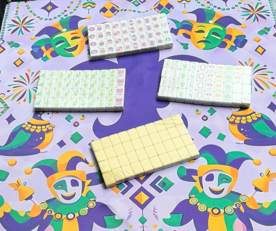 Colorful Mardi Gras-themed mahjong mat with yellow golden gleam mahjong tiles displayed on top of mat