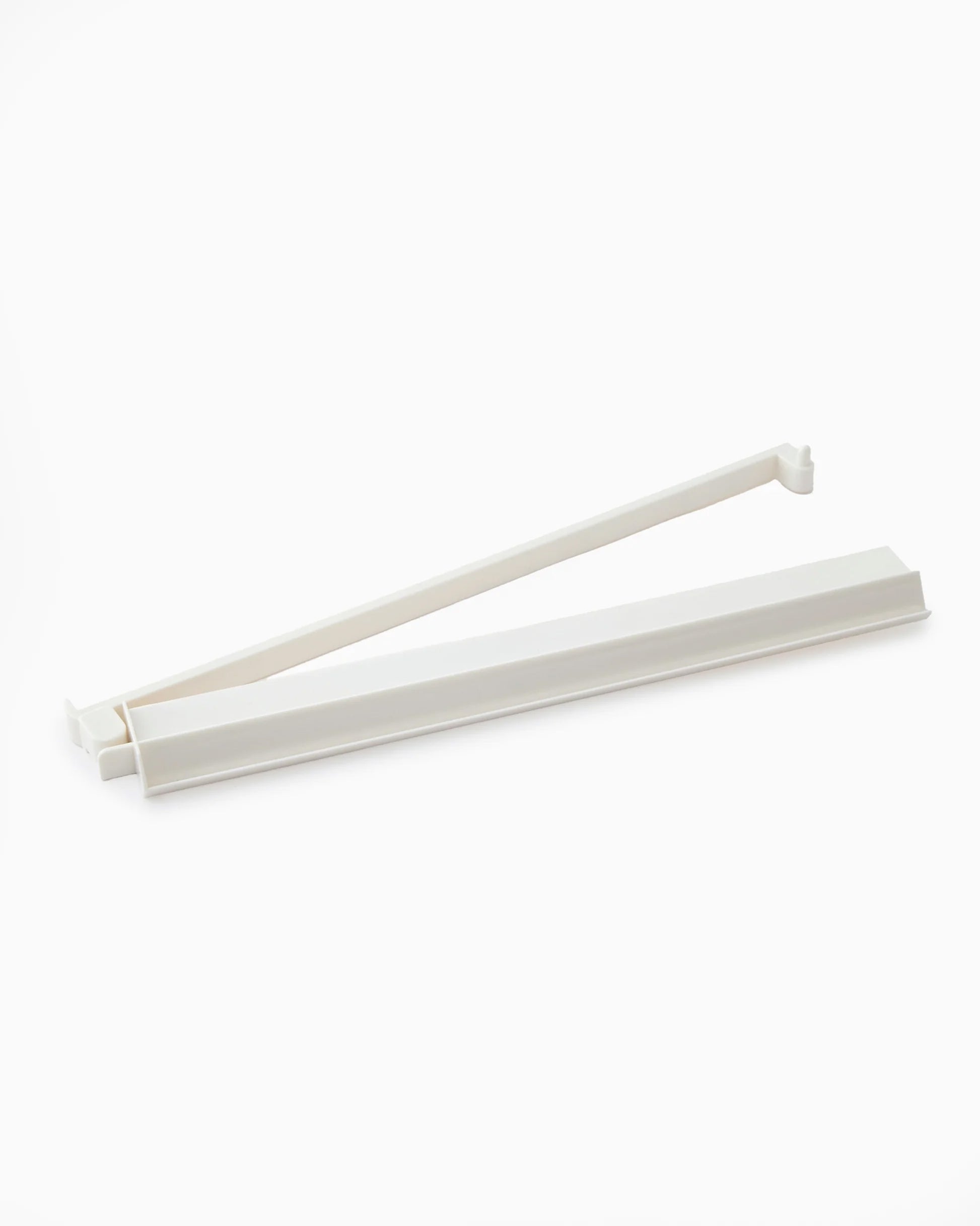 white acrylic mahjong rack with pusher with white background.