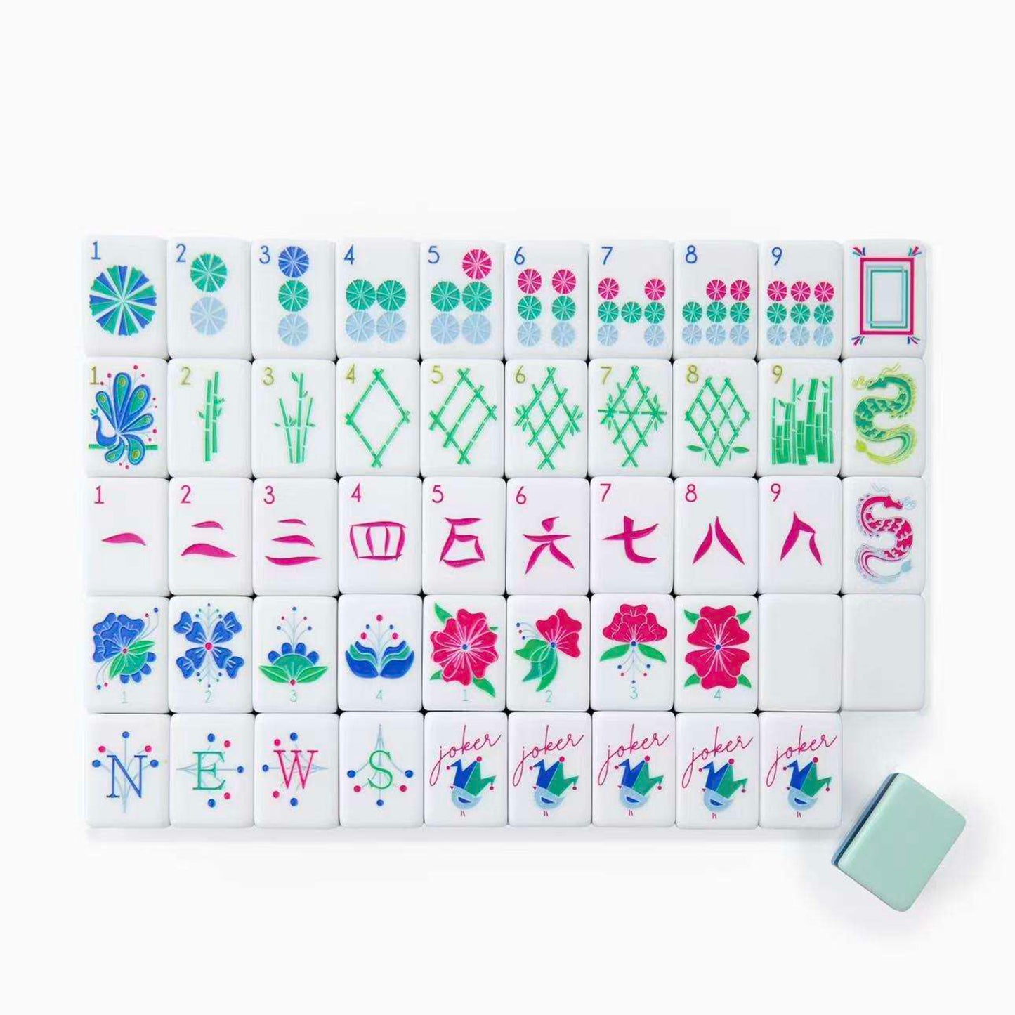 A set of acrylic mahjong tiles with pale turquoise backs.