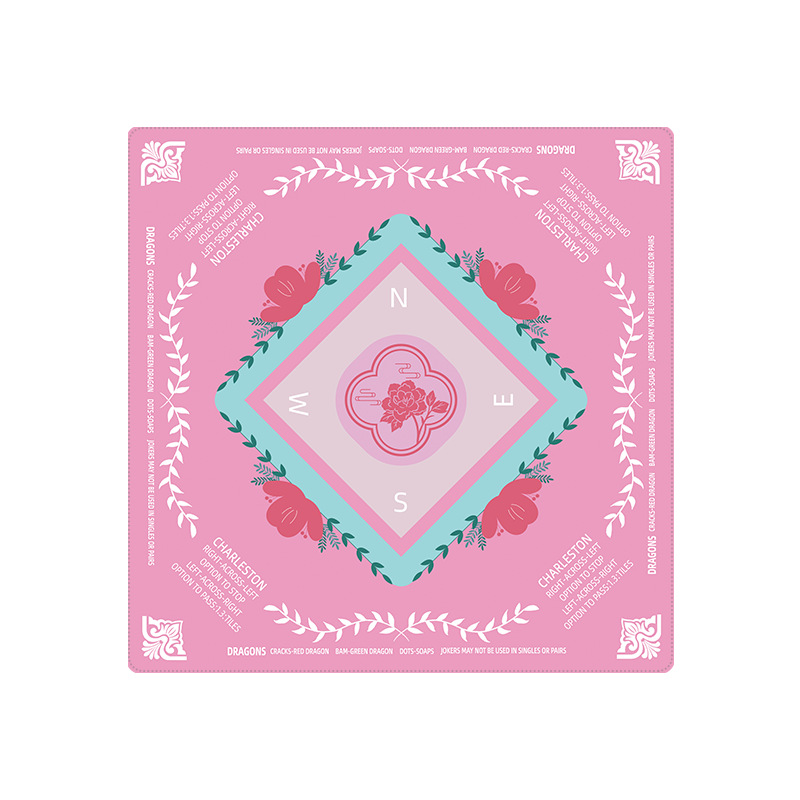 Pink mahjong mat with floral designs and text on a white background
