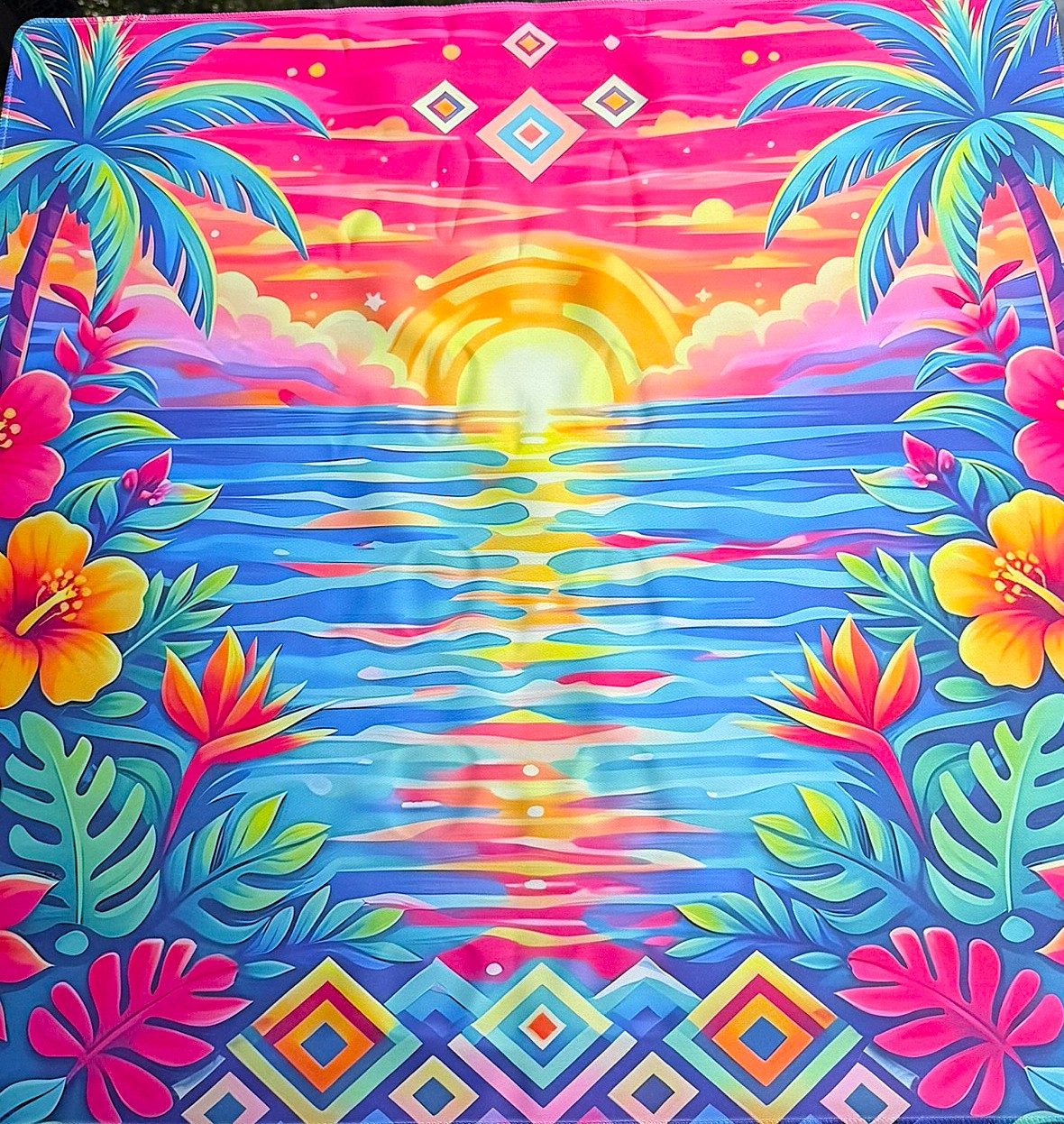 Mahjong Mat with Colorful tropical scene with palm trees, flowers, and a sunset, colors pink, blue, gold  yellow, gold, orange 