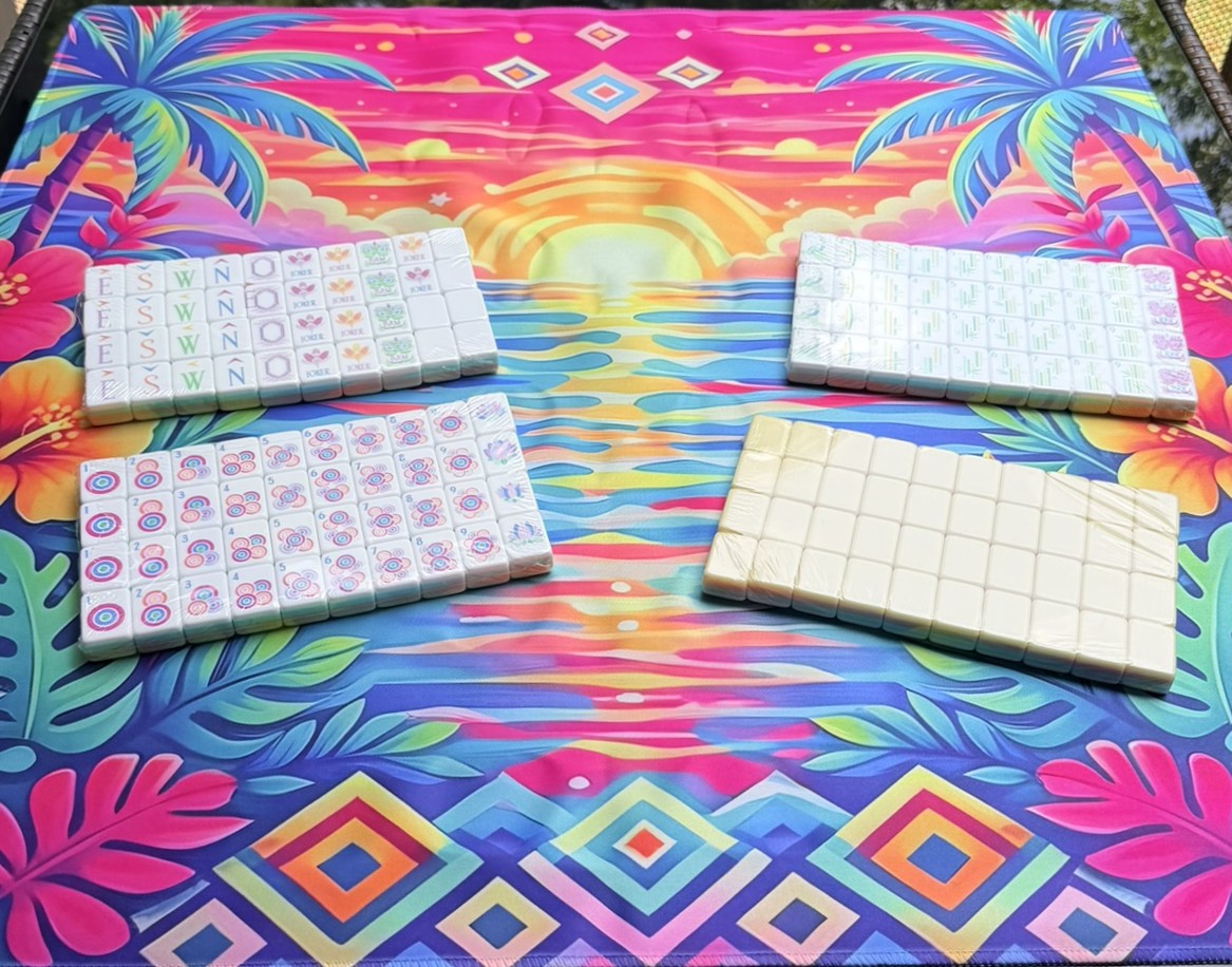 Set of tiles on a colorful  sunset patterned mahjong mat