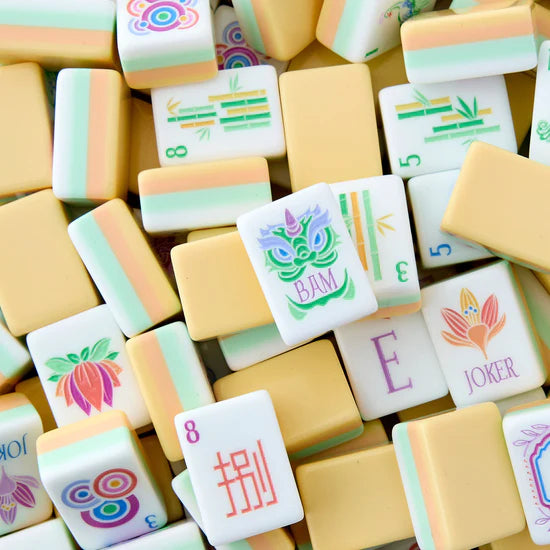 a pile of yellow and white acrylic mahjong tiles