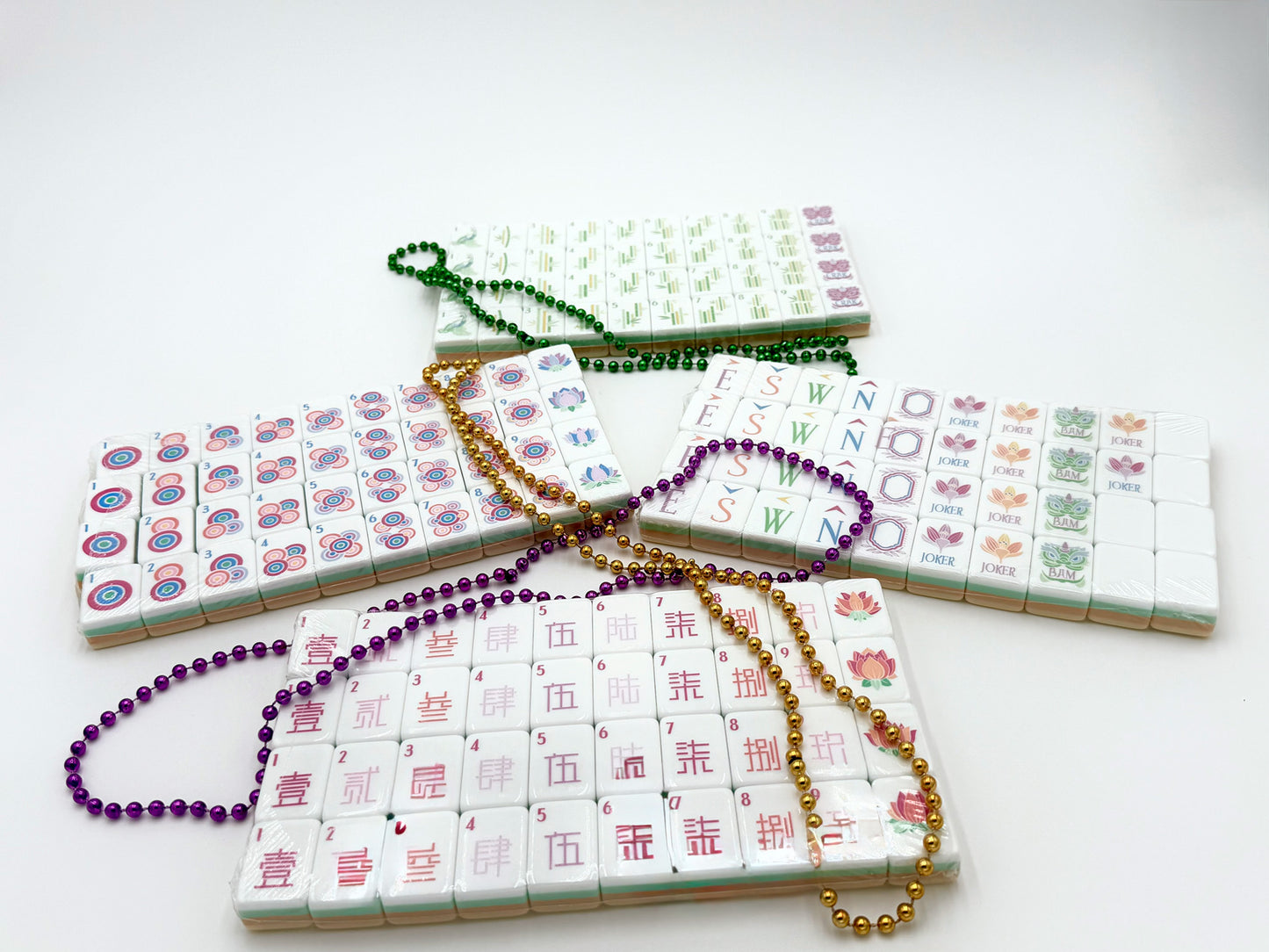 a set of yellow and white acrylic mahjong tile set with beads