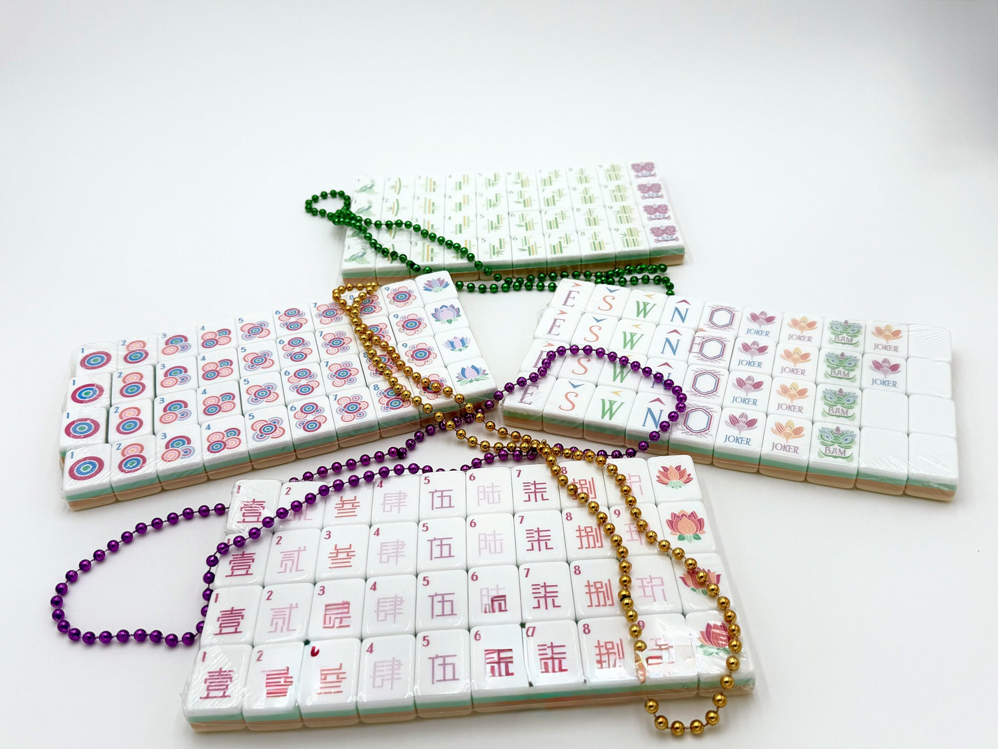 a set of yellow and white acrylic mahjong tile set with beads
